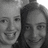Two women smile in a black-and-white photo with varying facial expressions across four