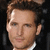 A man with light brown hair and blue eyes wears a black suit jacket over a white dress shirt, shown in four pixelated views.