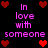 Pixelated text "In love with someone" in pink appears on a black background with red heart symbols arranged around the text.