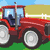 Pixelated of six showing tractors and text: red tractor on left, green tractor on right, and text "I think Tractors are Hoff!" in black-and-white pixel font