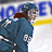 A 4-frame contact sheet of a hockey player in blue gear with yellow and white background elements, showing sequential motion from side view to front view.