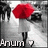 Pixelated static image shows a stylized figure with red hair, white clothing, and black accents against gray background; text 'Anjum' appears at bottom left.
