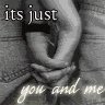 Black-and-white image of two hands clasped together with overlaid text reading "its just you and me" on a textured fabric background.