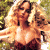 Pixelated image of a person with long blonde hair in an outdoor setting, next to green text reading 'Original Icons .com' on dark background.