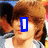 Pixelated image of a person with brown hair wearing white and gray clothing, overlaid with colored text blocks in blue, red, green, and pink.