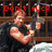 Pixelated image of a man holding a large gun with red text above him reading "Don't fuck with Chuck" against a wooden fence background.