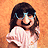 A 4-frame contact sheet of a pixelated animated buddy icon featuring a cartoon girl, text