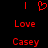 Red pixelated text and symbols on black background: vertical bars, heart symbol, 'Love', and 'Casey' in three