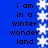Blue background with black text reading "i am in a winter wonderland" repeated vertically, flanked by white snowflake patterns on both sides.