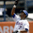 Pixelated image of a baseball player in white uniform with blue accents holding a bat, next to orange text reading "Reyes Is The Man" on black background.