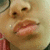 A close-up of a person's lower face with lips and nose, showing subtle animation changes in mouth position