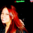Pixelated profile view of a person with long red hair against a black background, with a green status bar at the top.