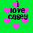 Green background with pink pixelated hearts and black text reading 'i love casey' in a repeating pattern.