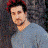 Four pixelated portrait show a person in different outfits and backgrounds, including red cap, blue shirt with yellow emblem, gray jacket, and white backdrop
