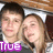 Two people stand side-by-side under a wooden structure with white trim; the left person wears a dark top, and the right person has long light hair. The word 'True' appears in purple text at bottom-left.