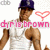 Pixelated image of a person wearing a dark blue cap and white tank top with pink text reading 'chris brown' across the chest, accompanied by a red heart symbol.