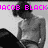 Pixelated grayscale image of a shirtless person with dark hair, overlaid by bright pink text reading 'JACOB BLACK' across the top.