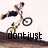 A pixelated animation of a person riding a bicycle over a dirt mound with text overlays changing across frames.