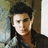 Pixelated image of a person with dark hair against a light background, surrounded by blue text blocks reading "Zac Effron is Sexy..", "Bak off hes Sarah's man!", and ":p".