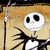 Animated Jack Skellington icon with shifting facial expression against a beige background, featuring black spiderweb lines.