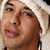 Two side-by-side pixelated portraits of individuals with distinct hairstyles and facial features, one wearing a light-colored headwrap and the other in dark clothing.