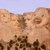 Pixelated image of Mount Rushmore with orange text 'MOUNT' vertically on black background and 'Duckmore' horizontally below, showing two distinct static states.