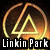 Pixelated icon featuring a glowing golden triangle inside a circular frame with orange and yellow gradients, set against a dark background, with 'Linkin Park' text below.