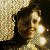 A 50x50 pixel animated contact sheet showing two frames of a buddy icon with a person on the left and green text on the right against a dark background.