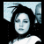 Four pixelated images of a person with long dark hair in different poses and color filters, arranged in a