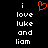 A black background displays white pixelated text reading "i love luke and liam" with a red heart symbol above the word "love."
