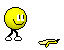 Yellow circular character with white eyes and black pupils walks left to right, then turns head down-left while holding a yellow banana-like object.