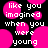Black background with pink circular shapes and white pixelated text reading 'like you imagined when you were young' in a repeating pattern.