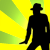 Silhouette of a figure in fedora and long coat against radiating yellow-green or purple-yellow background with visible pixelation.