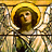 Pixelated image of a figure with brown hair and light skin, wearing a white garment under a golden halo against a blurred background.