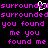 Pixelated text repeats across a black background with a white heart symbol overlaying the word 'surrounded' in the top