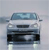 Pixelated front view of a light gray sedan with dark blue accents, headlights, and visible grille, set against a light gray background.