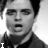 A 3x2 contact sheet of black-and-white animated frames showing a person's face with mouth open, displaying text fragments "I", "WALK", "A", "LONELY", and "ROAD" across the grid.