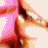 Animated sequence of a figure in red and gold attire against a pink background, showing motion