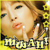 A person with light brown hair and makeup poses with a finger near their lips, wearing yellow clothing and star decorations.