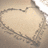 A pixelated heart-shaped icon with a light beige interior and dark brown border against a muted brown background.