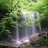 Animated sequence showing a waterfall scene transitioning to text overlay with 'God is an Artist' in stylized fonts.