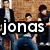 A pixelated image of a group of people with overlaid text and symbols, showing two states: one with 'jonas brother' text and another with '<3' symbol.