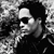Black-and-white photo of a person with dark hair and sunglasses on the left, next to text reading Lenny Kravitz, IT IS, TIME FOR AVAILABLE NOW, LOVE, REVO-LUTION in white and red.