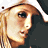 A 48x48 pixel animated contact sheet showing three sampled frames of a celebrity's face with varying expressions and angles, arranged in a 2x2 grid on a gray background.