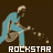 Pixelated image of a person in light blue clothing playing an electric guitar against dark brown background with "ROCKSTAR" text below.