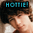 A pixelated image shows a person with brown hair and light skin wearing a white top, with 'HOTTIE!' text in cyan on black above.