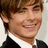 Pixelated image of a person with light brown hair wearing a black suit and white shirt, accompanied by text phrases on a black background.