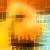Pixelated abstract composition with warm orange and yellow gradients transitioning to cool blue tones, featuring dark brown rectangular shapes against a blurred background.