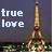 Pixelated image showing 'true love' text on left and Eiffel Tower on right against dark background.