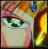 Pixelated close-up of a face with green eyes, pinkish skin tones, and a yellow-orange gradient background.